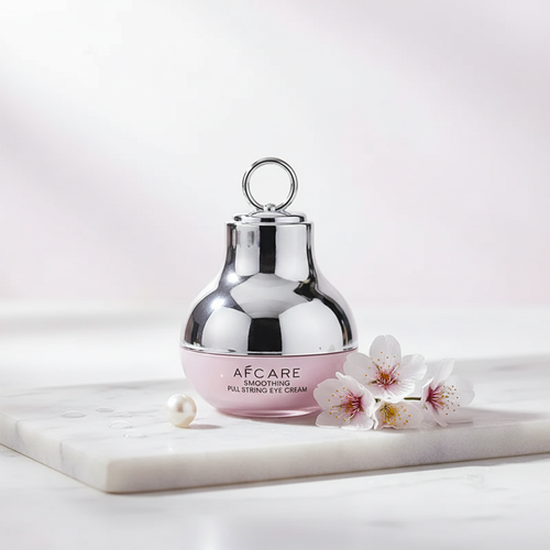 NuraEye advanced collagen eye cream jar on white marble with white flowers